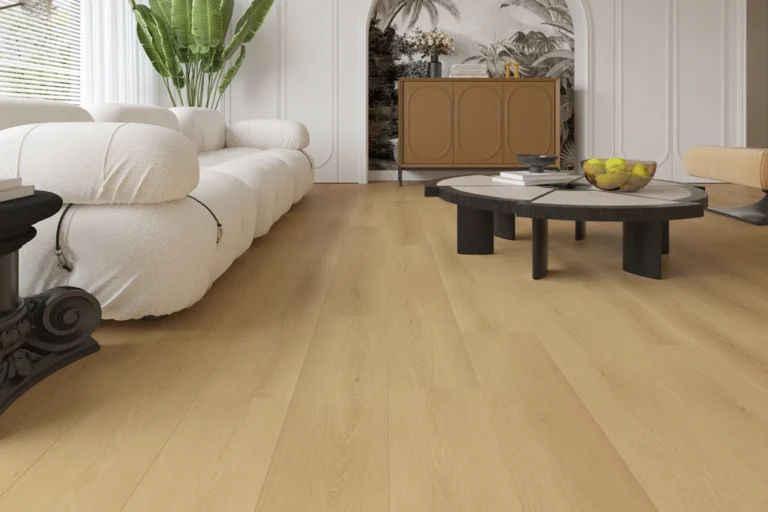 Laminate flooring in a modern living room setting, featuring light-colored planks, a white sofa, and a round coffee table with decorative items, showcasing a stylish and durable flooring option ideal for homes with kids and pets.