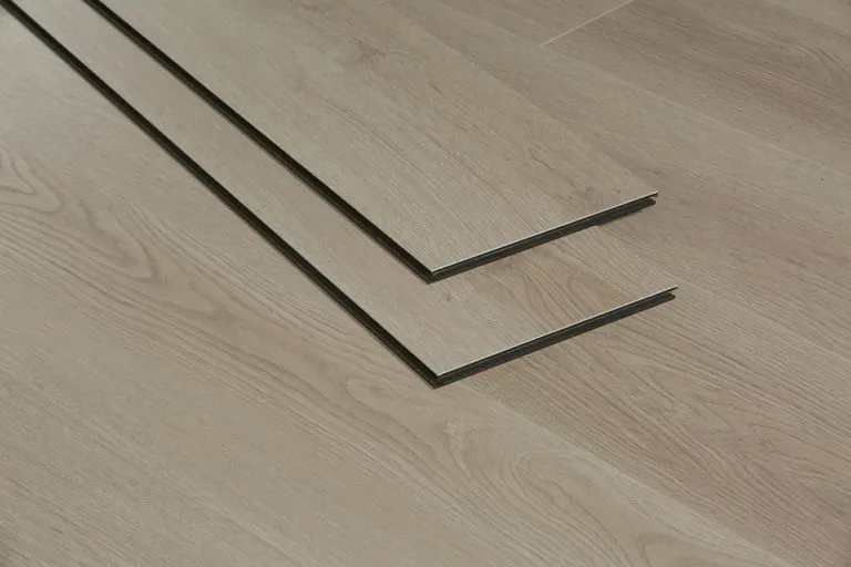 Fawn Grey Royal 10mm Extreme hybrid flooring planks showcasing realistic woodgrain texture, designed for durability and waterproof protection.