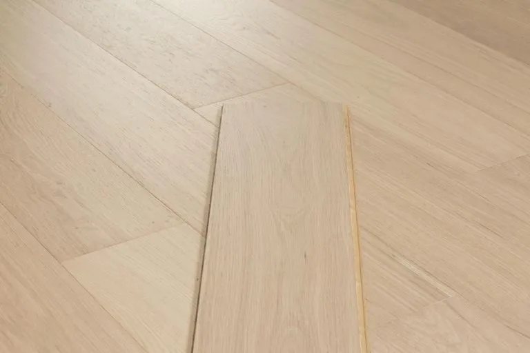 Royal 14/2mm Oak flooring in Chamomile color, showcasing a natural wood grain texture and light tones, ideal for stylish interior design.