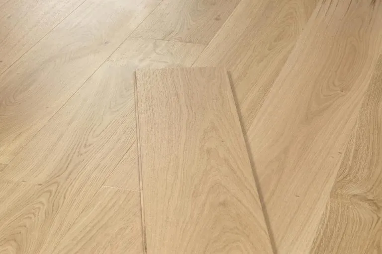 Natural oak flooring planks showcasing the Royal 15/4mm Oak style, emphasizing the elegant texture and finish suitable for residential spaces.