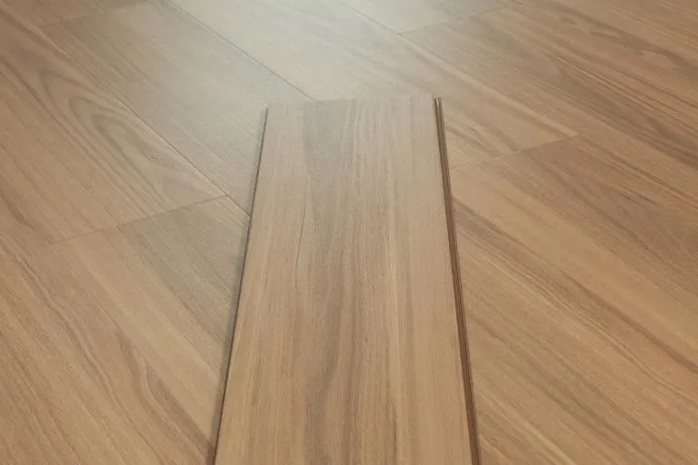 Spotted Gum laminate flooring planks showcasing realistic wood grain and texture, part of RoyalStep 12mm collection, emphasizing durability and water resistance.