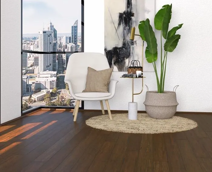 Walnut dark bamboo flooring in a modern living room with a chair, side table, and potted plant, showcasing an urban view.