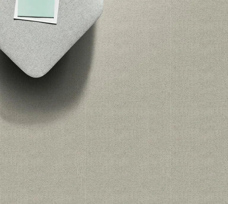 Cut pile carpet sample in Aruba color, showcasing a textured surface, ideal for enhancing residential spaces with Caribbean-inspired design.