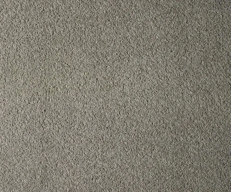 Textured gray flooring sample from the York Cliffs collection, showcasing a soft, plush pile designed for durability and stain resistance, embodying coastal aesthetics.