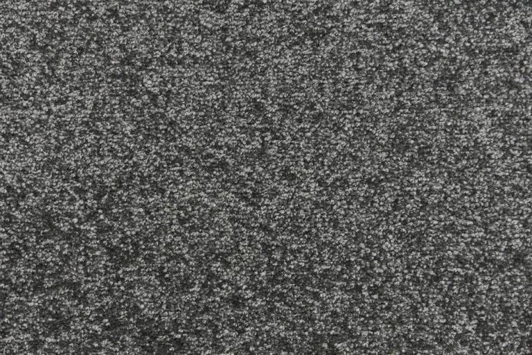 Textured dark gray carpet sample representing the 'Snowfield' color option from the Herragan collection, showcasing durability and stain resistance for high-traffic areas.