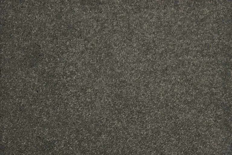Textured dark gray carpet sample from the Herragan collection, showcasing durability and stain resistance, relevant to the Snowfield product offering by Royal Floors.