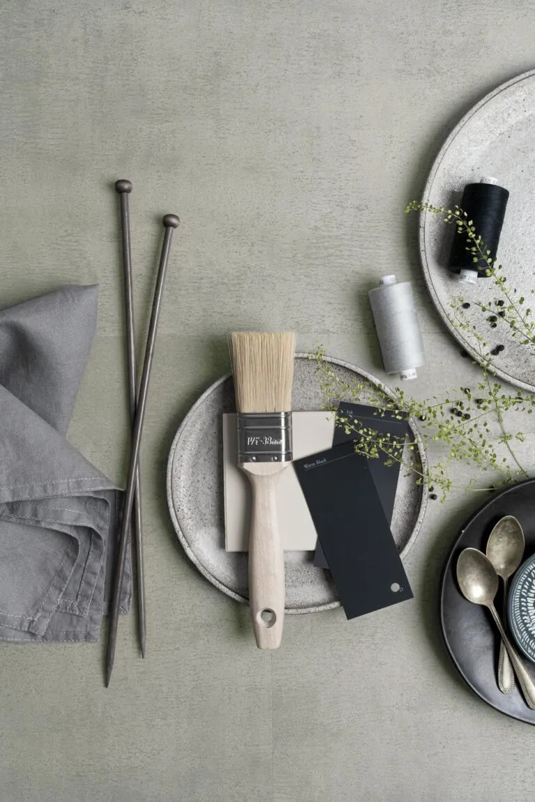Mood board featuring paintbrush, color swatches, and decorative elements on textured surface, illustrating design inspiration for Loose Lay Originals Tiles, specifically 'Utah' color variant.
