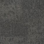 Magnitude carpet tile in a textured dark gray color, designed for modern interiors and high-traffic areas, reflecting durability and contemporary style.