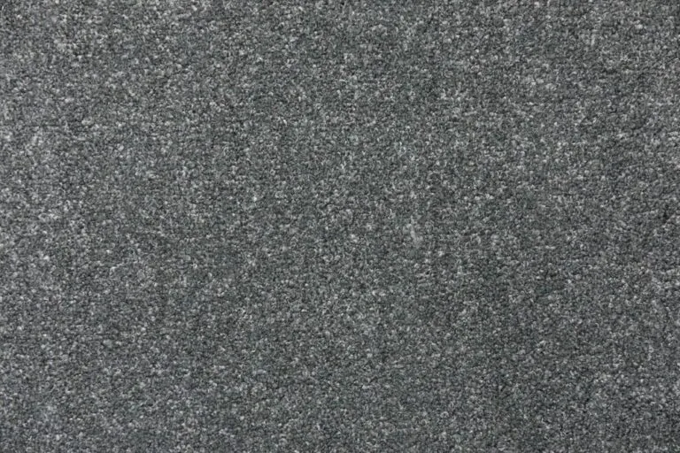 Textured gray carpet sample from the Herragan collection, showcasing durability and stain resistance, relevant to the Snowfield carpet offering by Royal Floors.