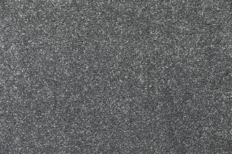 Cala carpet sample in a textured dark grey color, showcasing a dense, velvet-like appearance suitable for sophisticated living spaces.