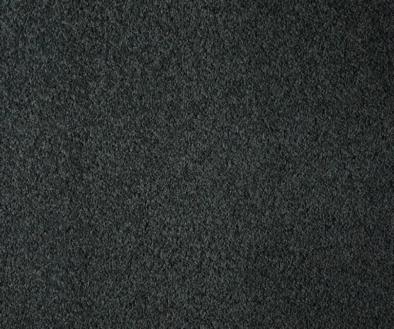 York Cliffs flooring sample, showcasing a soft, plush texture in a dark color, designed for high performance and stain resistance, ideal for families and coastal aesthetics.