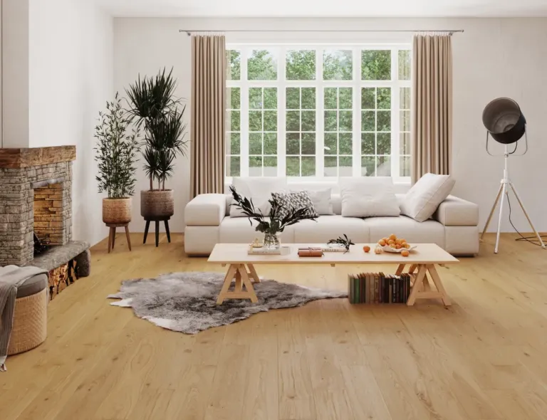 Pure Natural Oak flooring in a modern living room setting, featuring a cozy sofa, decorative plants, and a stone fireplace, emphasizing a blend of elegance and natural beauty.