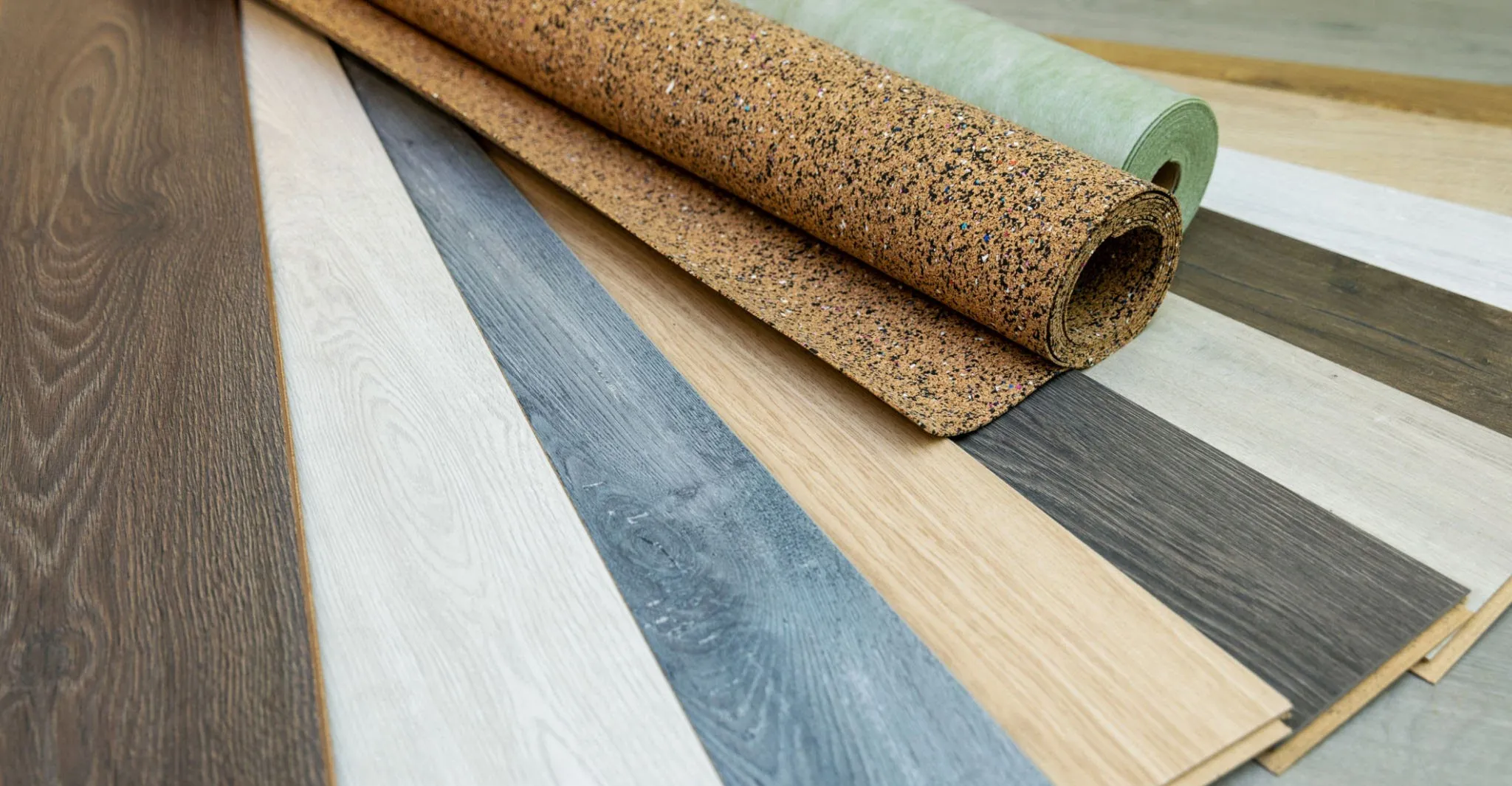 Variety of flooring materials including wood, cork, and vinyl samples