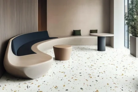 Stylish Opus Tiles flooring in a modern residential living room featuring a white base with colorful terrazzo speckles, complemented by contemporary furniture.