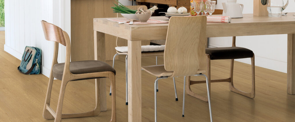 Light oak laminate flooring in a modern dining room