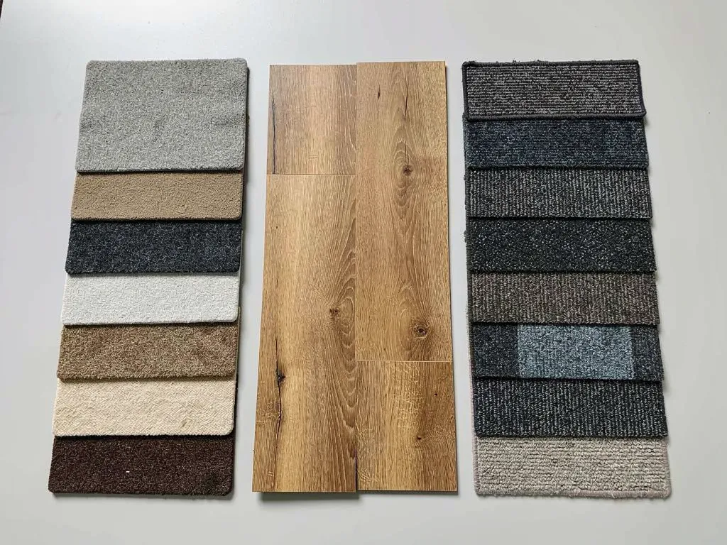 Carpet samples displayed on shelves in a flooring showroom